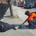 Photo of Teen Praying Over Homeless Man in Baltimore Goes Viral